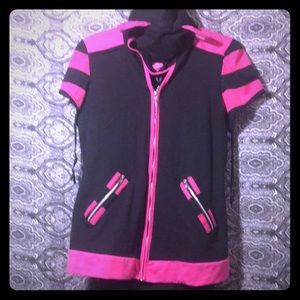 Cat face hood over jacket/black dress.